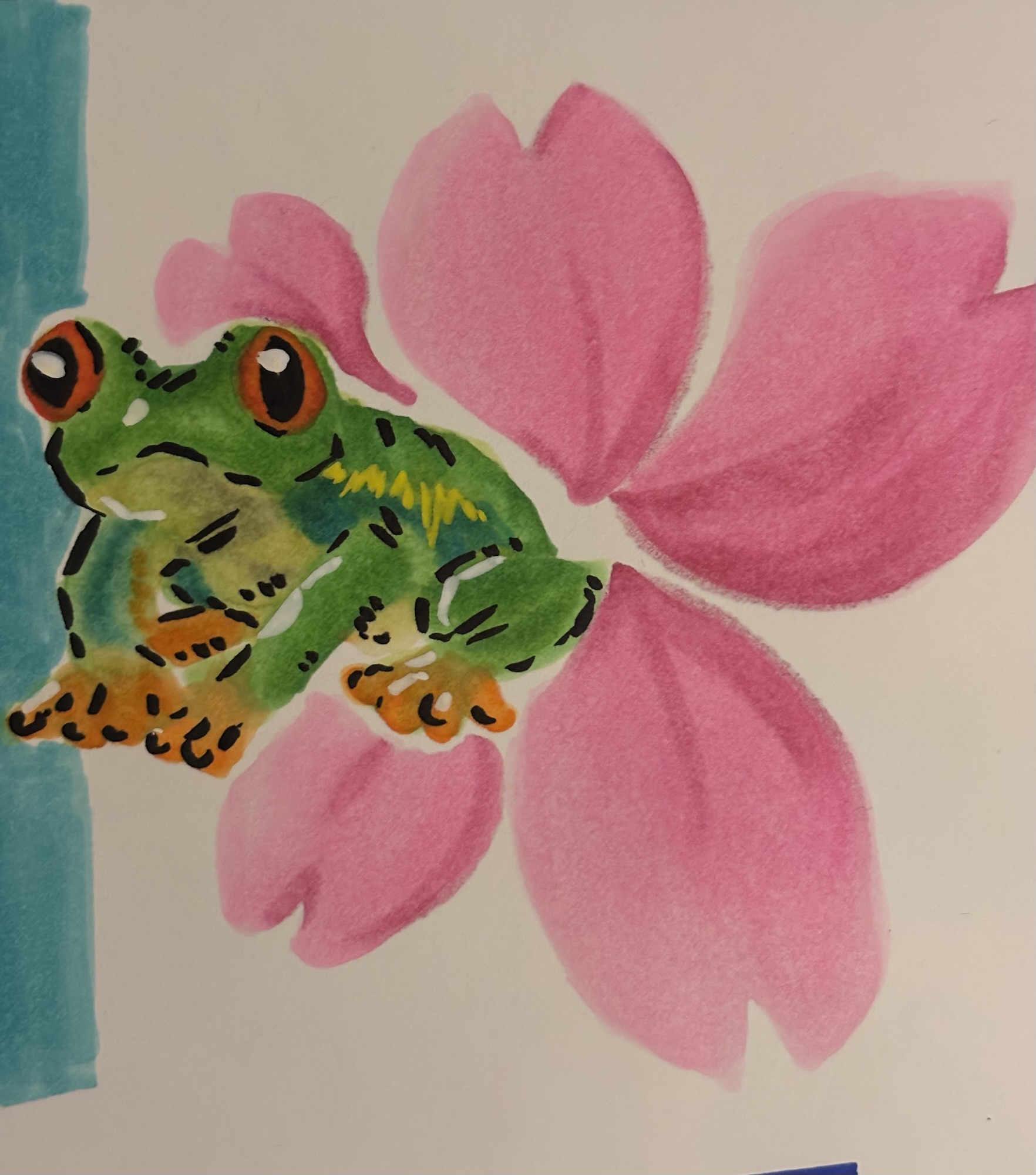 A small marker drawing of a tree frog over a pink flower in the background